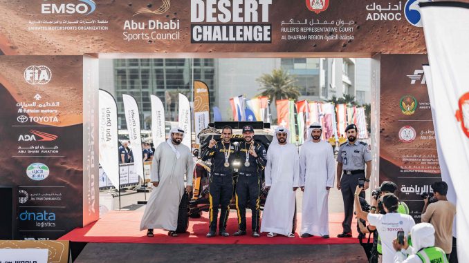 Podium celebrations for Jones and Mena in Abu Dhabi.