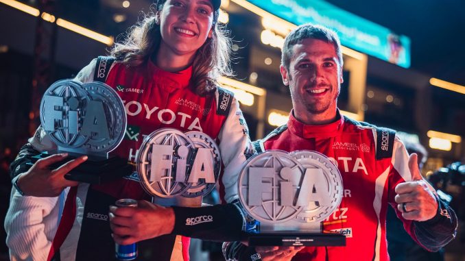 Dania Akeel celebrates FIA Middle East Baja success with co-driver and Stephane Duple.